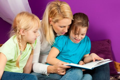 Woman Reading to Kids